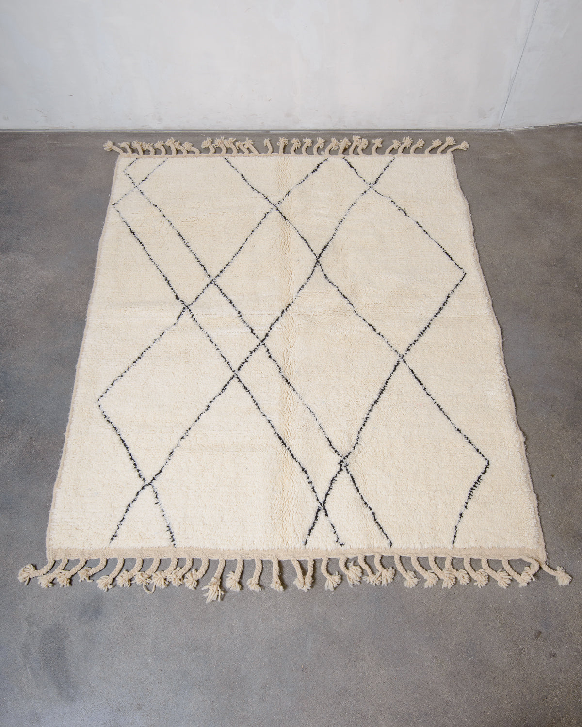 Modern, designer, handcrafted Berber rug from Morocco. Beniourain carpet with minimalist design, natural wool pile and a fluffy texture.